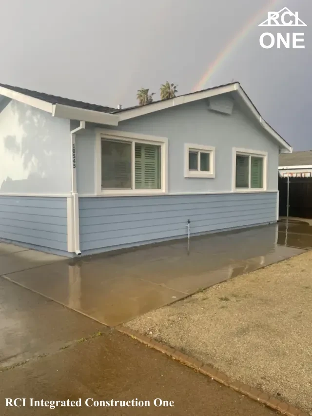 Freshly Painted House with Rainbow